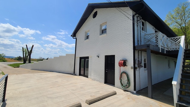 view of side of home featuring a deck