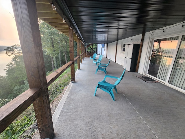 view of patio terrace at dusk