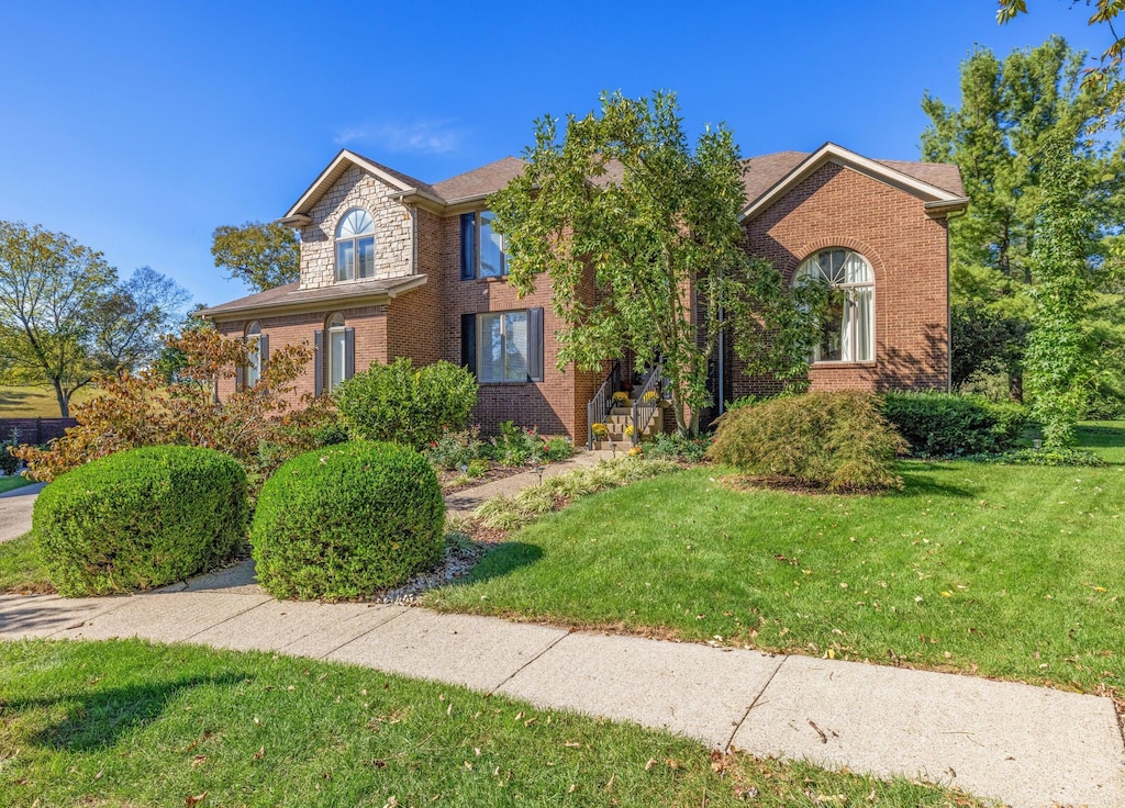 front facade with a front lawn