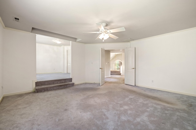 empty room with carpet, ceiling fan, and crown molding