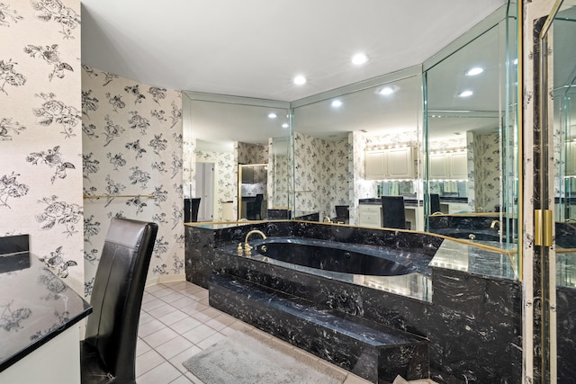 bathroom with tile patterned floors and tiled tub