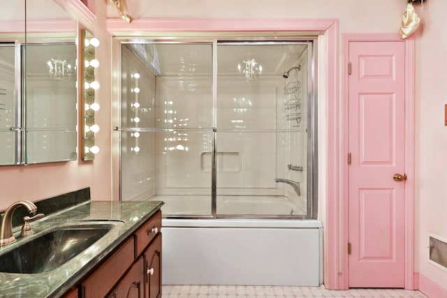 bathroom with enclosed tub / shower combo and vanity