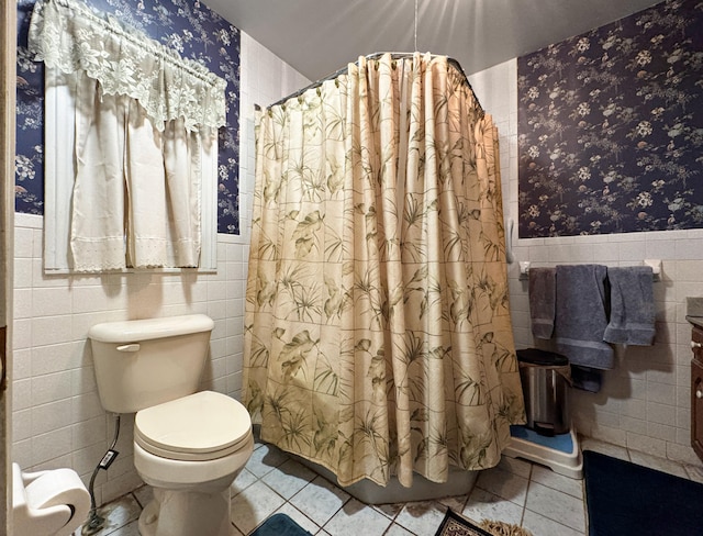 bathroom featuring tile walls, vanity, tile patterned flooring, and toilet