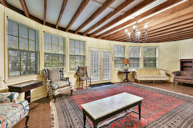 interior space featuring an inviting chandelier, french doors, and beamed ceiling