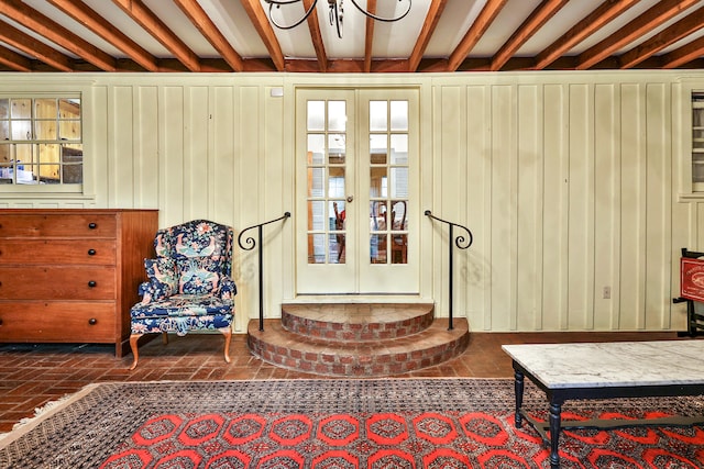 sitting room featuring beam ceiling