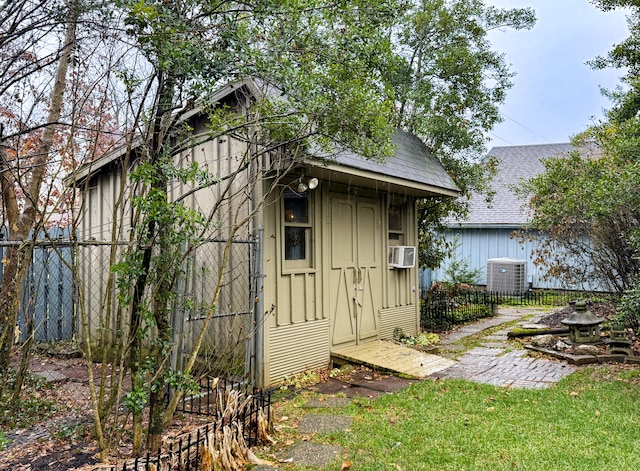 view of outdoor structure featuring cooling unit and central AC