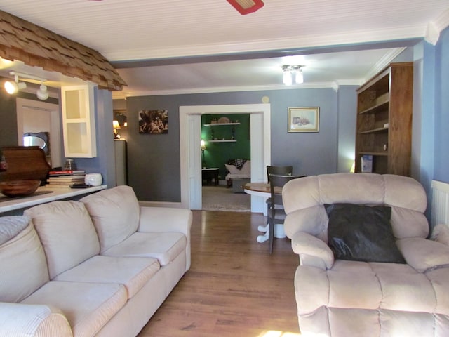 living room with hardwood / wood-style flooring and ornamental molding