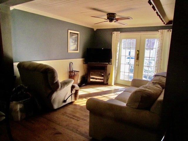 living room featuring french doors, ceiling fan, crown molding, and light hardwood / wood-style flooring