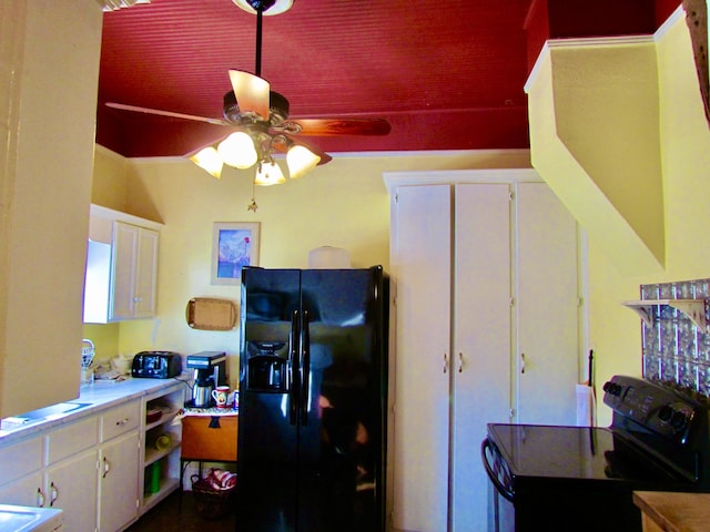 kitchen featuring ceiling fan, black appliances, and white cabinets