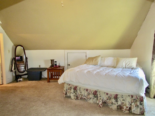 bedroom featuring lofted ceiling and light colored carpet