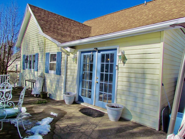 rear view of property featuring french doors