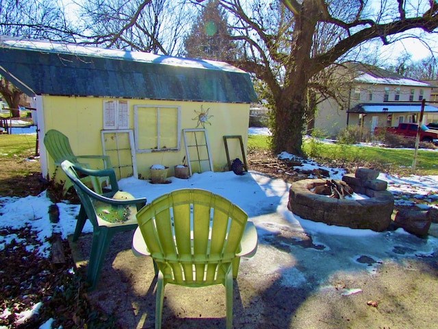 view of yard with an outdoor fire pit