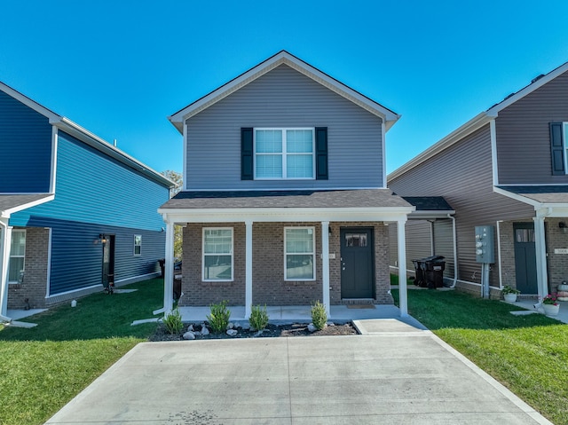 front of property featuring covered porch and a front lawn