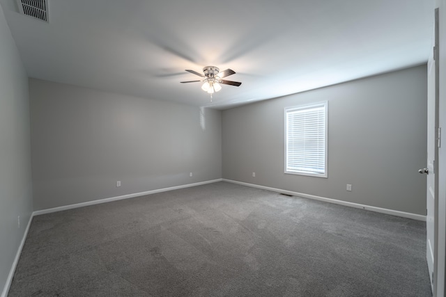 carpeted empty room featuring ceiling fan