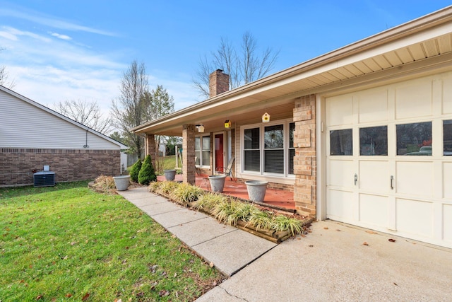 property entrance featuring cooling unit, covered porch, and a yard