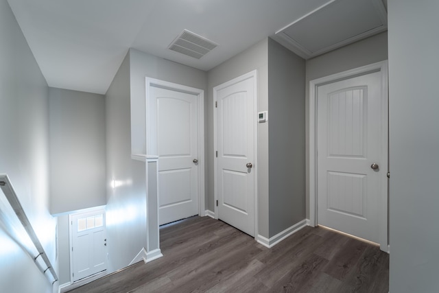 hallway with dark hardwood / wood-style floors