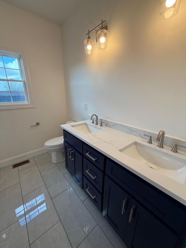 bathroom with vanity and toilet