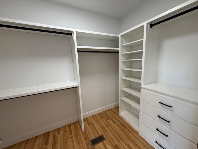 walk in closet featuring light hardwood / wood-style floors