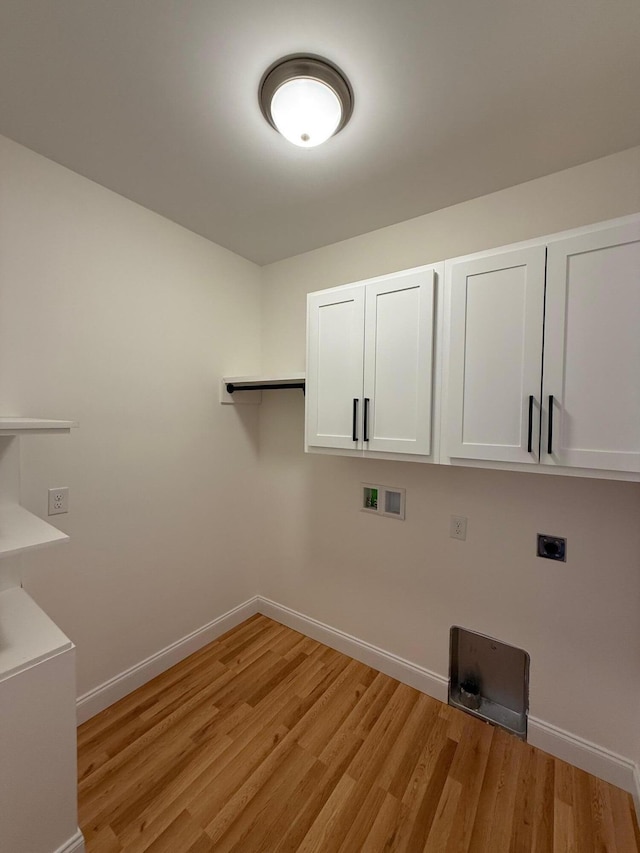 laundry area with cabinets, washer hookup, light hardwood / wood-style flooring, and electric dryer hookup