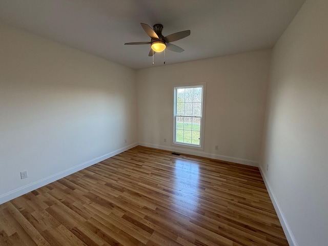 unfurnished room with ceiling fan and light hardwood / wood-style floors