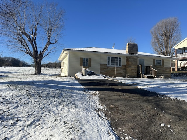 view of snow covered house