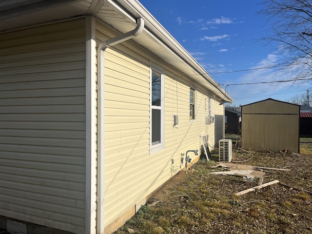 view of home's exterior with a shed