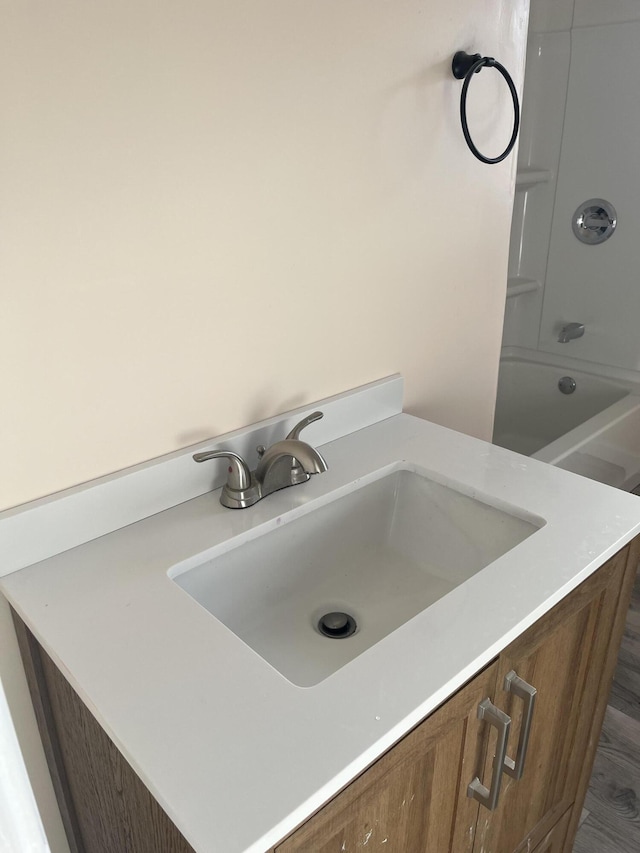 bathroom featuring vanity and bathtub / shower combination