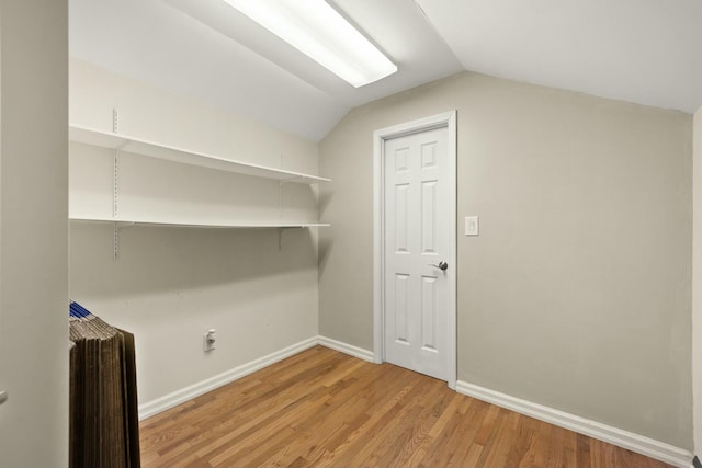 laundry area with light wood-type flooring