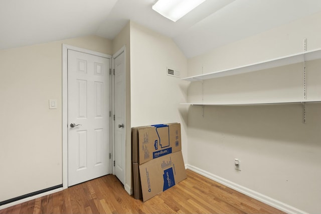 washroom with hardwood / wood-style floors