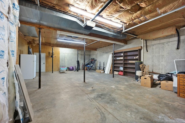 basement with white refrigerator