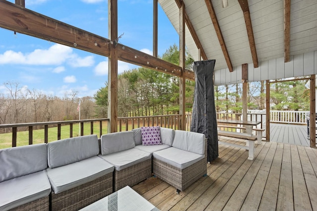 wooden terrace featuring an outdoor living space