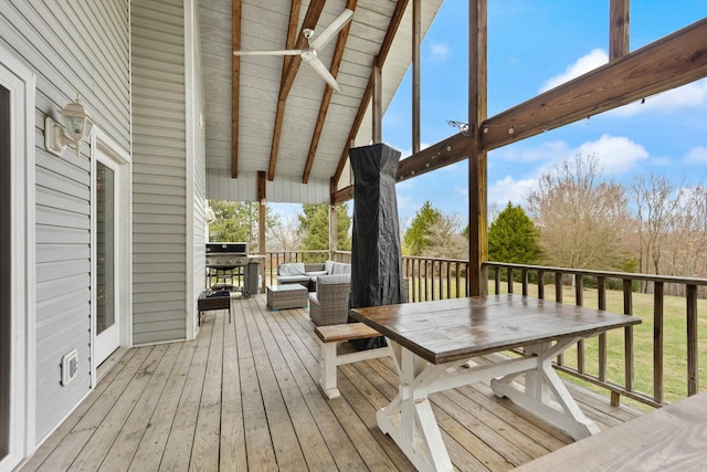 deck with outdoor lounge area, ceiling fan, and grilling area