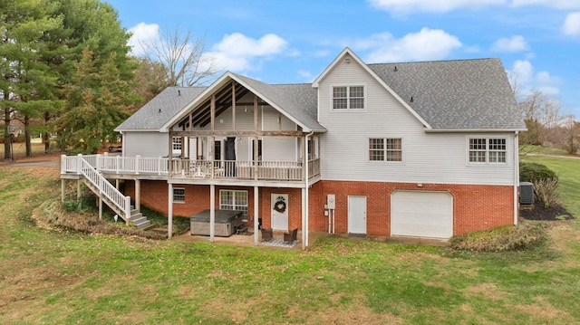 rear view of house with central AC, a yard, a wooden deck, and a garage