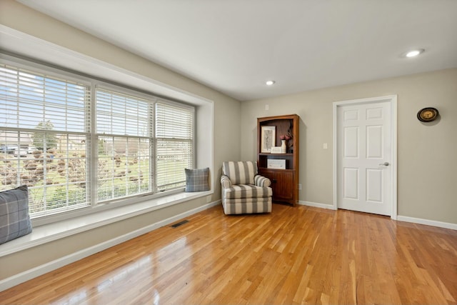 living area featuring light hardwood / wood-style floors