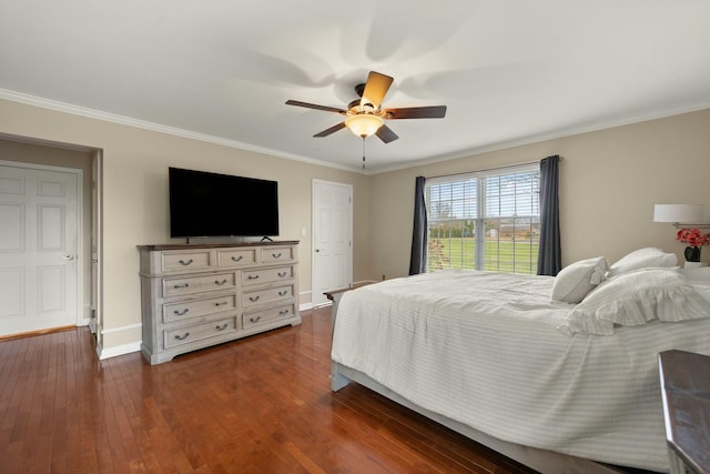 bedroom featuring ornamental molding, ceiling fan, and dark wood-type flooring