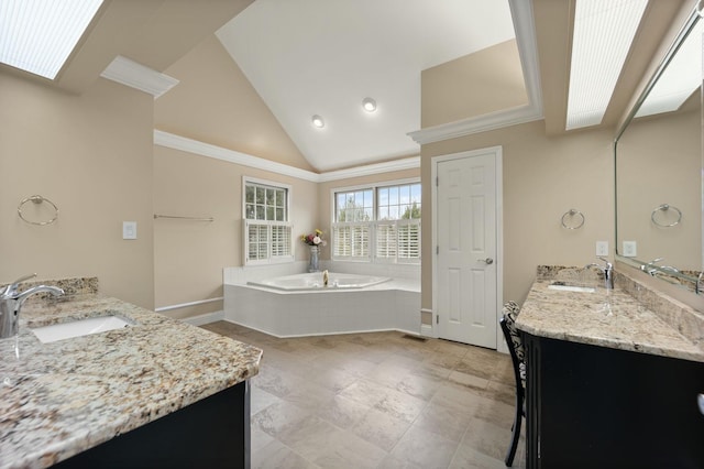 bathroom featuring ornamental molding, vanity, a relaxing tiled tub, and lofted ceiling