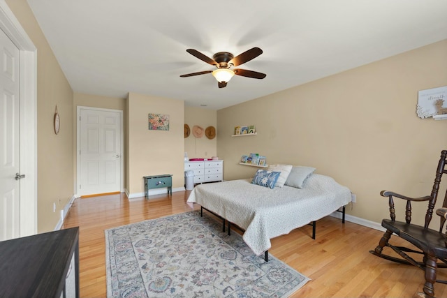 bedroom featuring ceiling fan and light hardwood / wood-style flooring