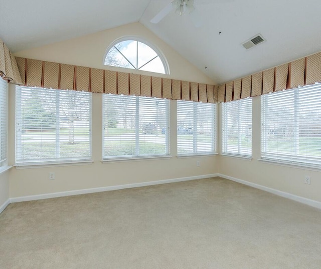 unfurnished sunroom featuring ceiling fan and vaulted ceiling