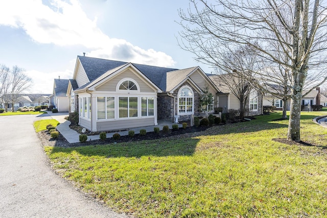 view of property exterior featuring a garage and a lawn