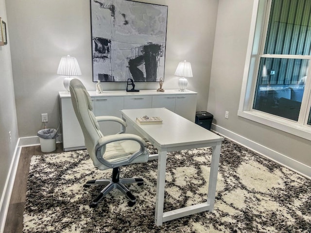 home office with hardwood / wood-style flooring