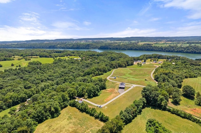 birds eye view of property featuring a rural view and a water view