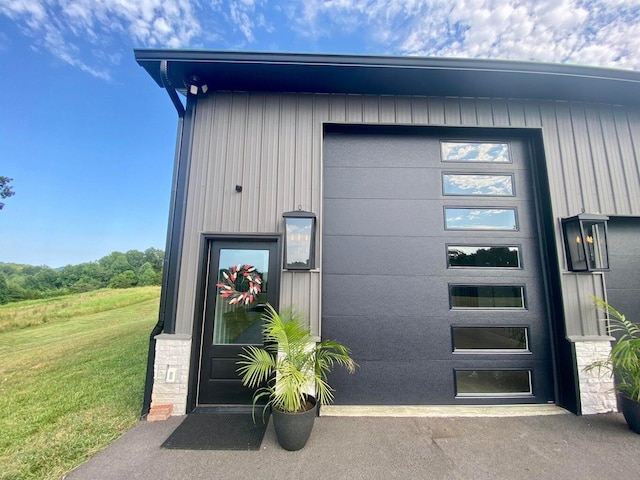 property entrance with a yard