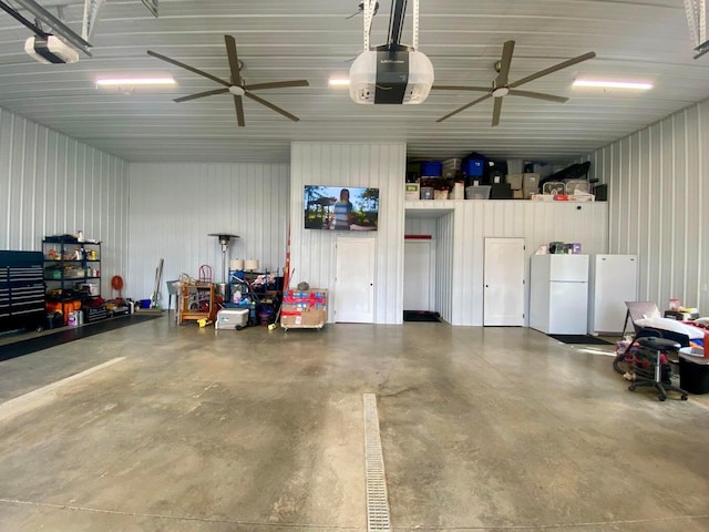 garage with a garage door opener and white refrigerator