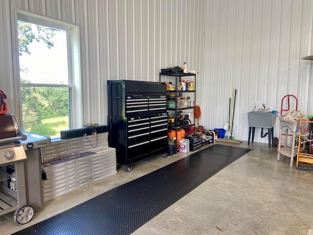 garage featuring wooden walls