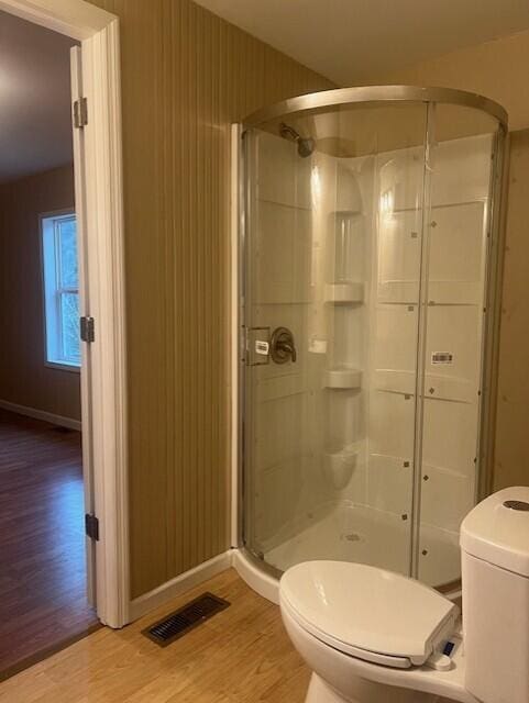 462 E Main St, Inez, KY 41224 - bathroom with an enclosed shower, toilet, and wood-type flooring