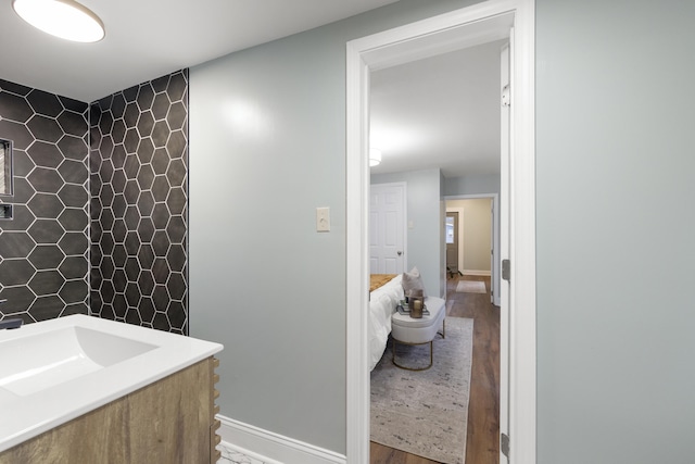 bathroom featuring wood-type flooring and vanity