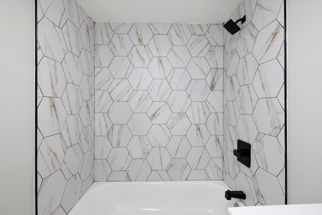 bathroom featuring washtub / shower combination