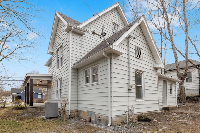 view of side of home with cooling unit