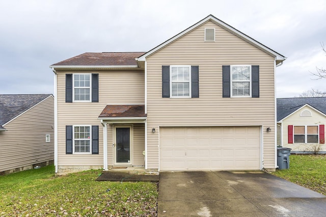 view of front of property featuring a garage and a front lawn