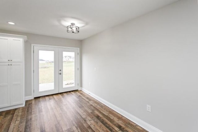 doorway to outside with french doors and dark wood-type flooring